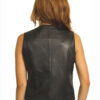 The back view of a woman wearing a Women Black Genuine Baby Lamb Leather Vest, a Classic Form Flattering Design#871.